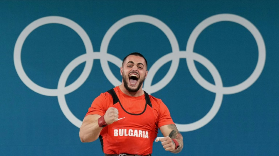 'Man from Mars' Nasar wins Olympic weightlifting gold with new world record