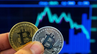 Stocks slip as bitcoin hits fresh record high