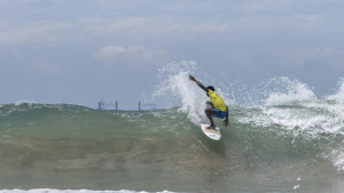 Nigerian surfers brave oil pipelines, tankers to catch waves