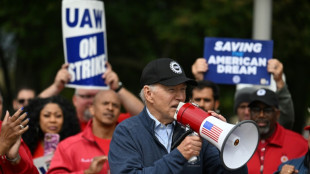 Biden makes history by joining US auto workers picket line