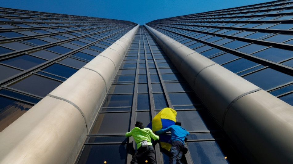 Urban climbers scale Paris' highest tower to show solidarity with Ukraine