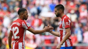 Carrasco scores late penalty to see 10-man Atletico past Espanyol