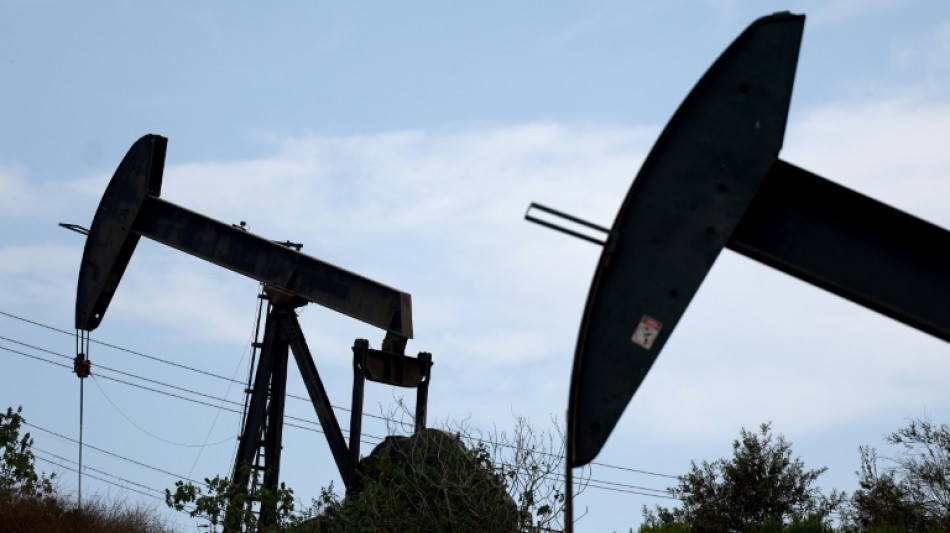 Oil prices cool after hitting highest levels in almost a year