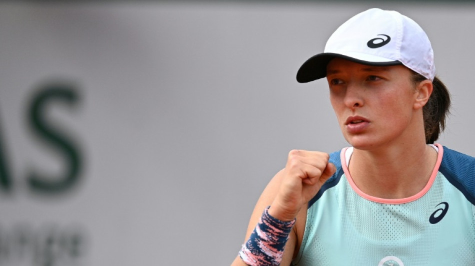 Swiatek races to 30th successive win as Tsitsipas survives another French Open epic