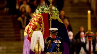 Queen Elizabeth's children guard coffin in solemn vigil