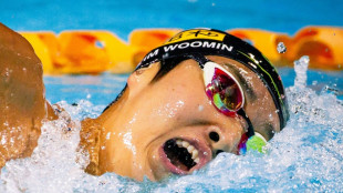 Australian swim coach avoids being kicked out of Olympics