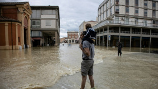 Italy flood deaths rise to 13 as thousands wait to come home