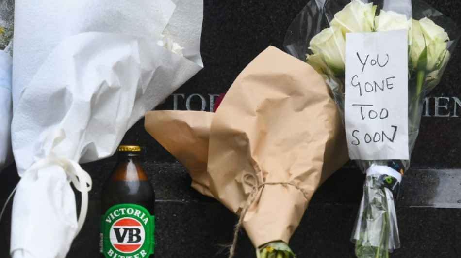 Flowers, beers, ciggies and a meat pie: Australian fans mark Warne's death