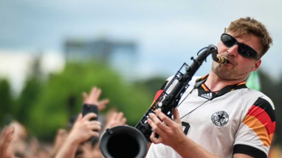 German fans dance to the tune of the 'saxophone guy'