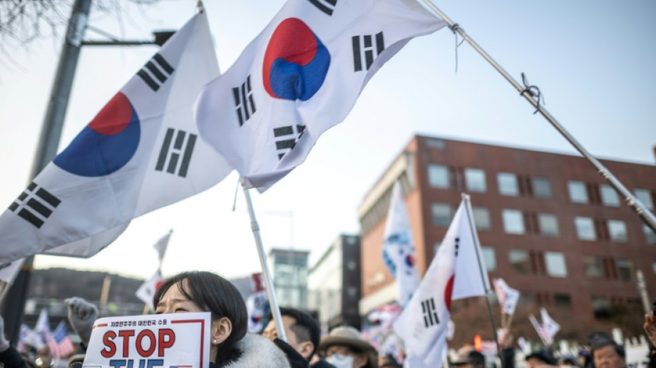 South Korea's Yoon resists arrest over martial law bid