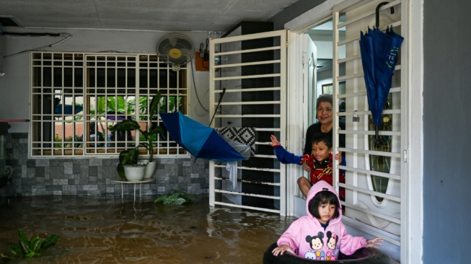 At least four dead, tens of thousands evacuated in Malaysia floods