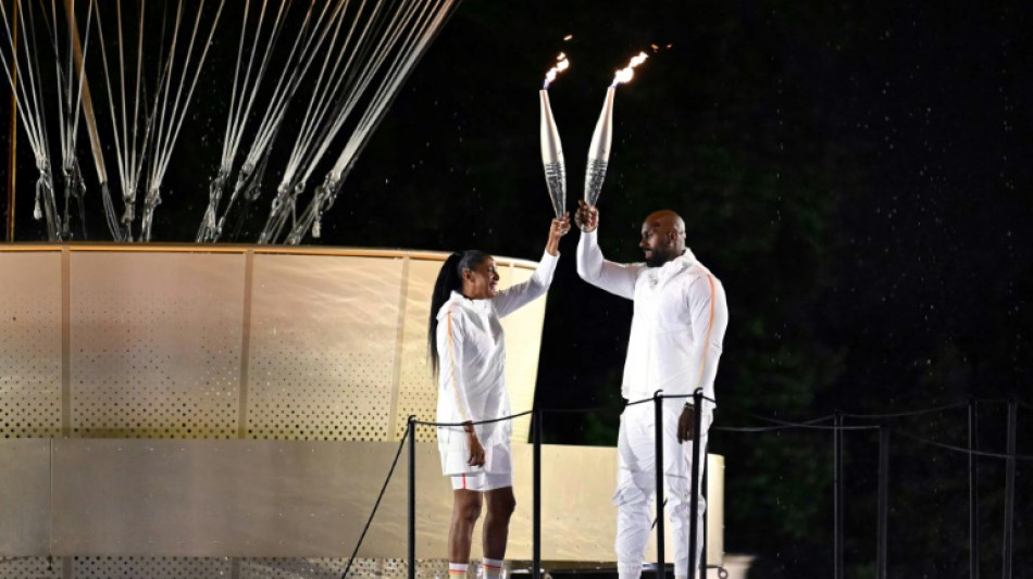 Historic river parade, Dion show-stopper ignite Paris Olympics